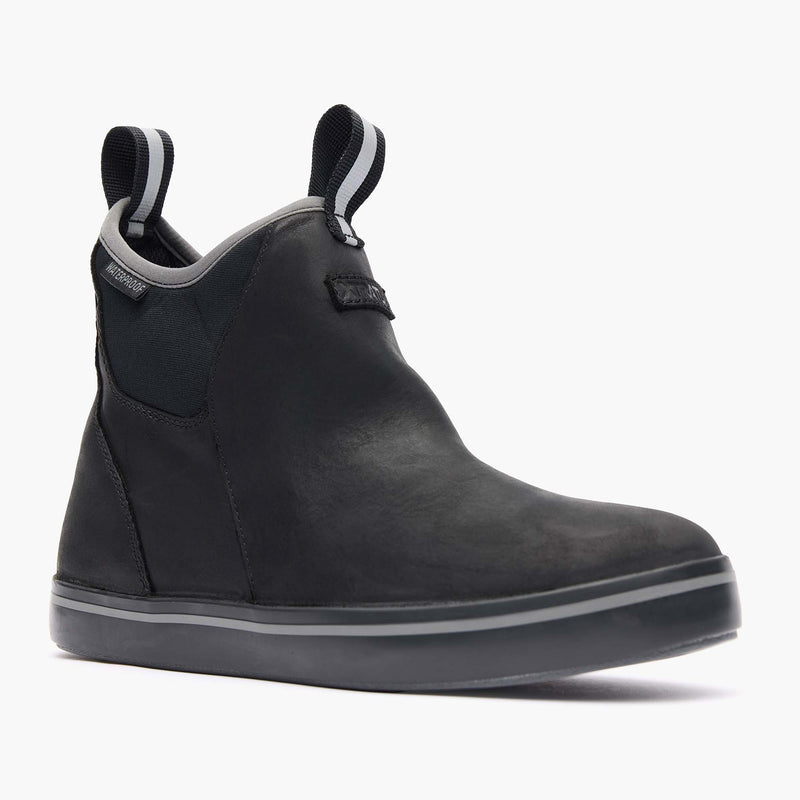 Black ankle boot with gray sole on a white background