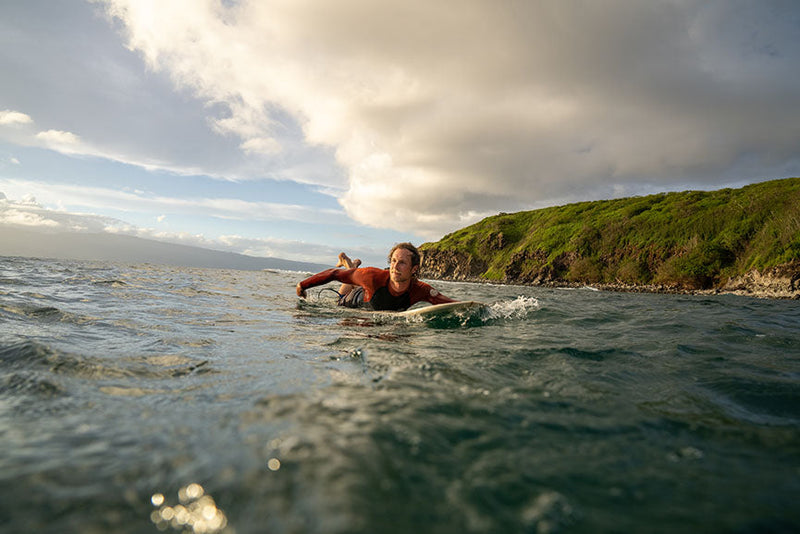 Tommy on surfboard in ocean