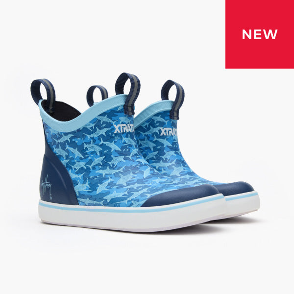 Blue camouflage shoe with Xtratuf branding on a white background