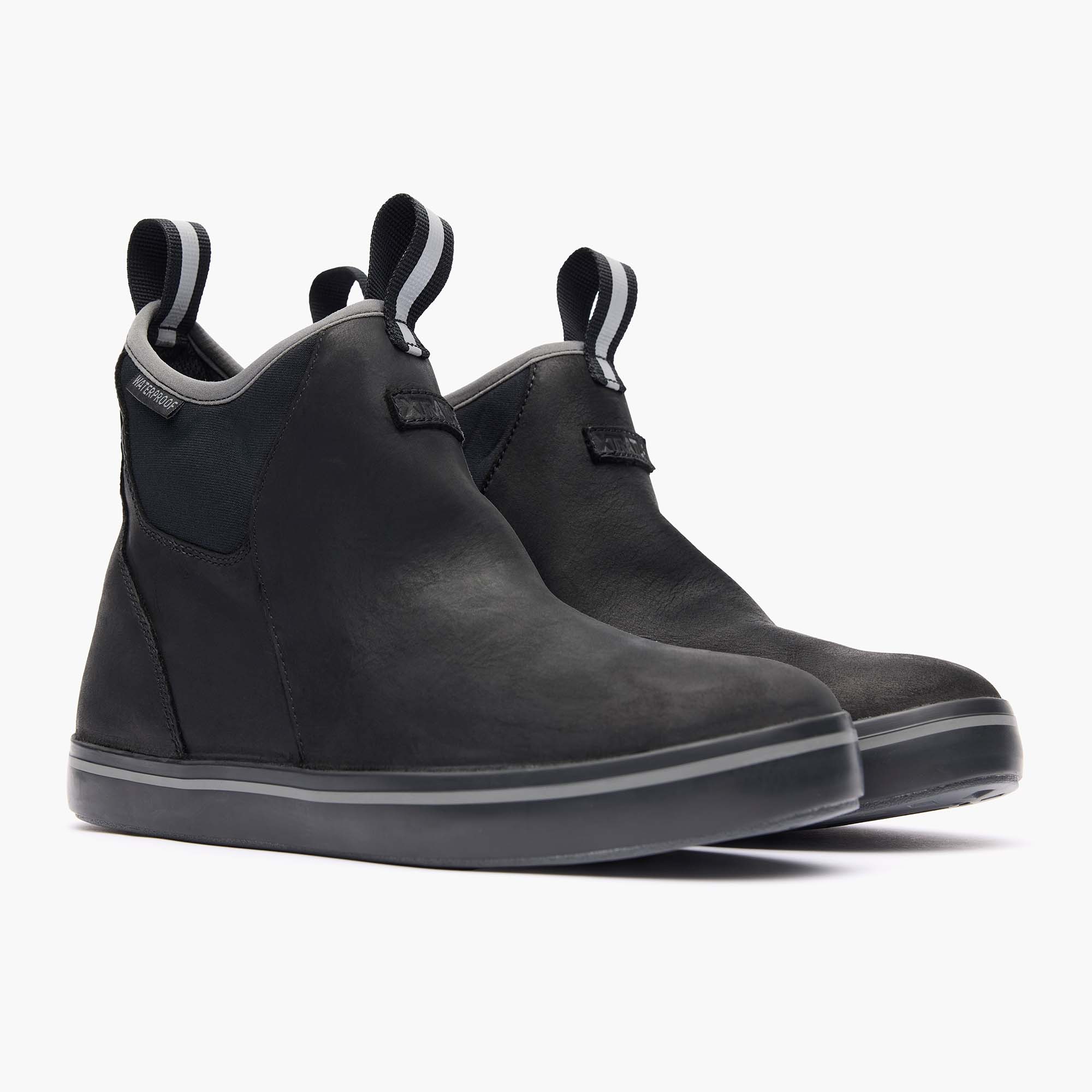 Pair of black ankle boots on a white background