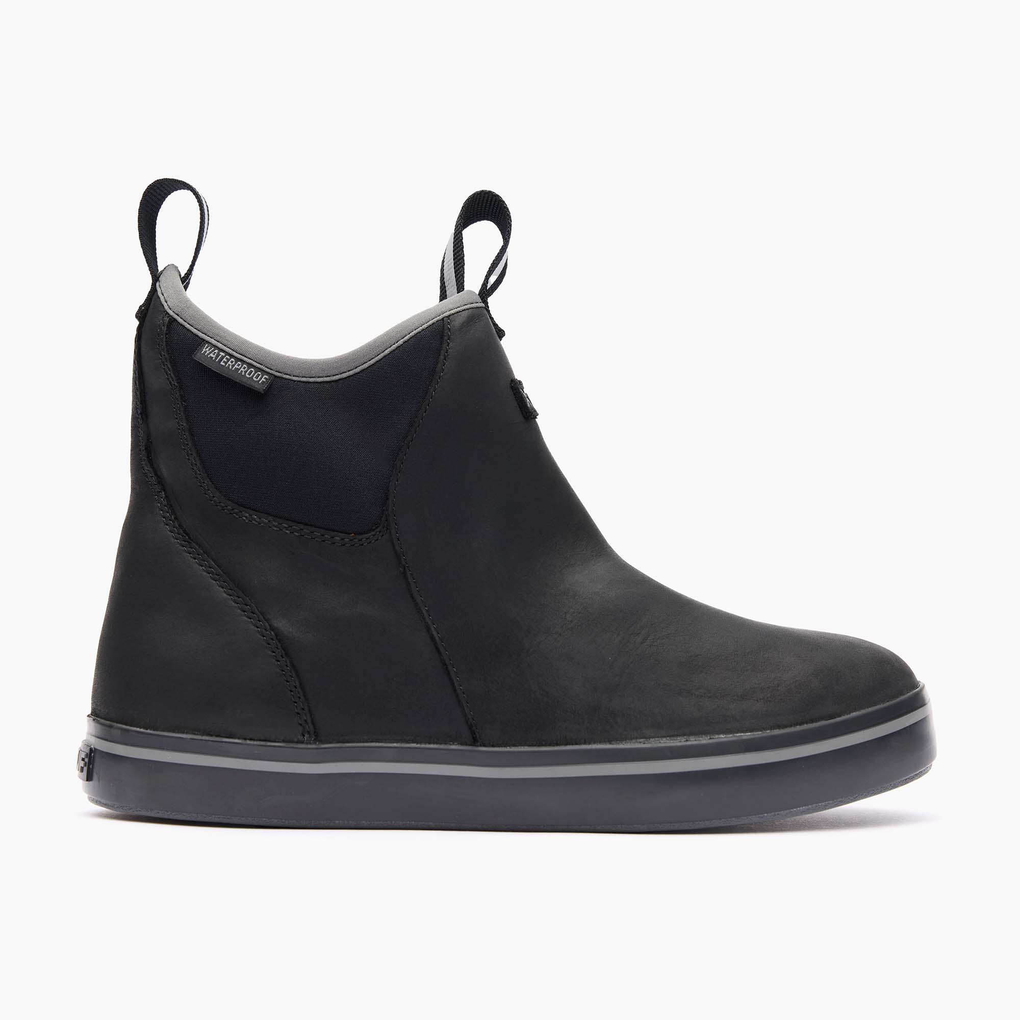 Black slip-on boot with gray sole on a white background
