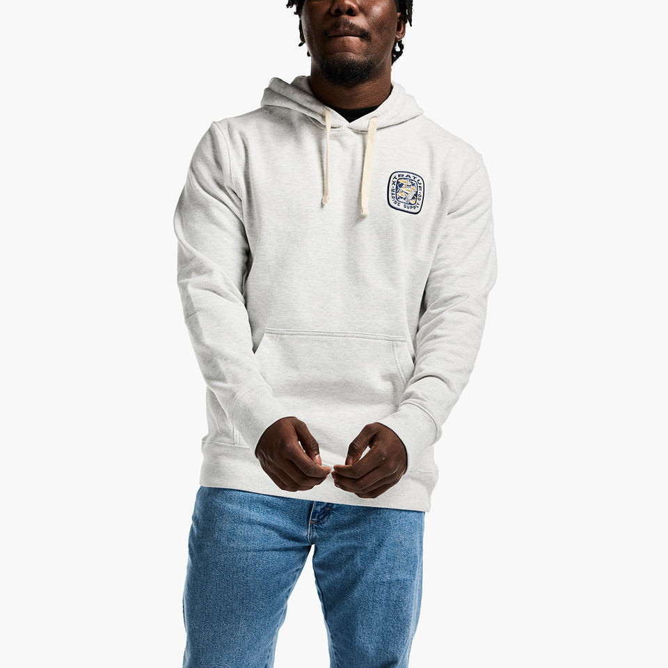 Person wearing a white hoodie with a logo on a white background