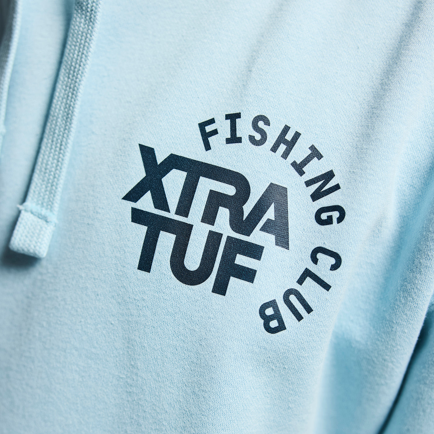 Light blue hoodie with 'Fishing Club Xtra Tuf' text on a white background