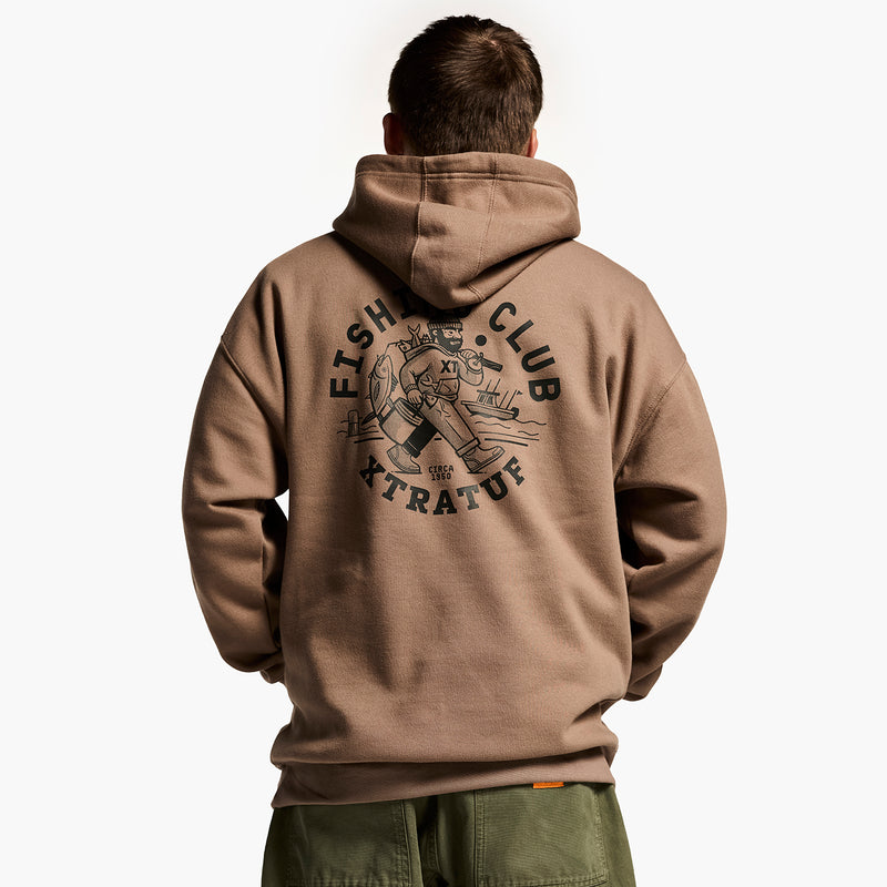 Person wearing a brown hoodie with 'Fish Club Extravaganza' text and design on the back.