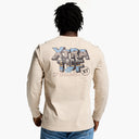 Person wearing a beige long-sleeve shirt with 'Xtra Tuf' branding on the back, standing against a white background.