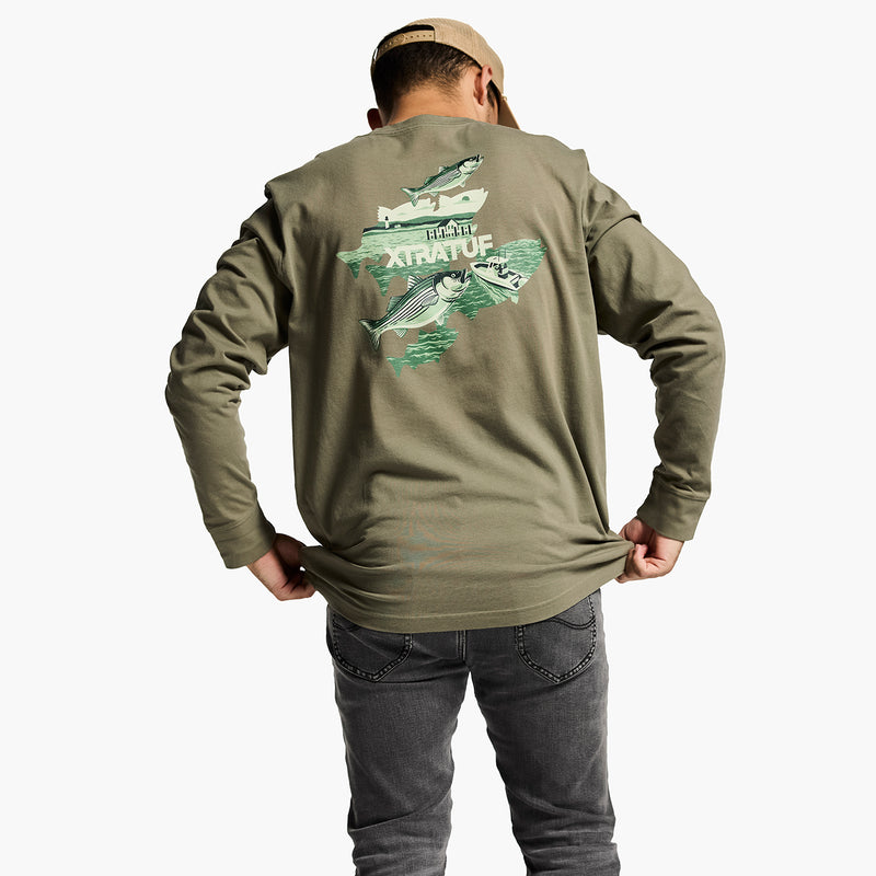 Person wearing a green long-sleeve shirt with a fish design on the back, standing against a white background.