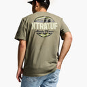 Person wearing a green t-shirt with 'XTRATUF' branding on the back, standing against a white background.