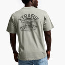 Person wearing a gray t-shirt with 'Xtra Fun Fishing Club' graphic on the back.